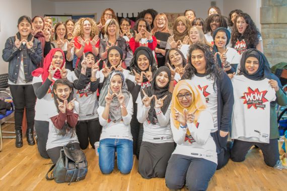 A group of women in WOW branded t-shirts