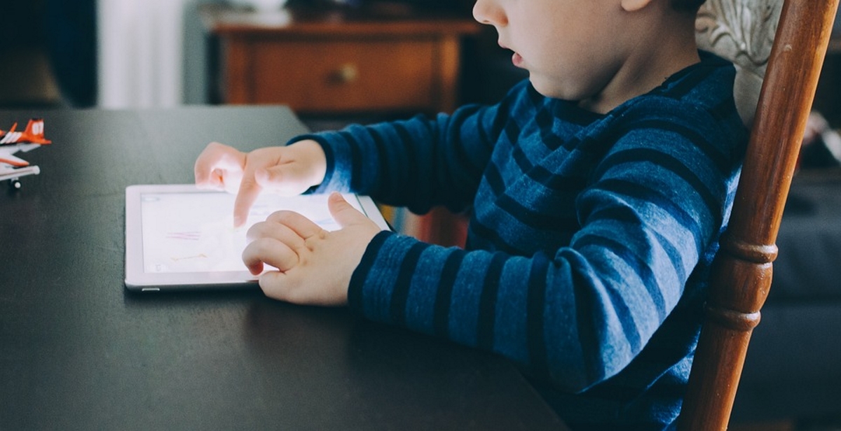 Kid on tablet