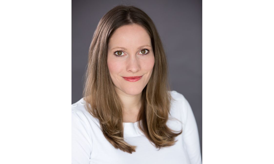 A photo of the author Laura Bates, wearing a white t shirt