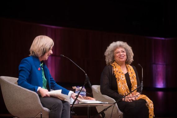 Jude Kelly and Angela Davis sit on stage at WOW London in 2019