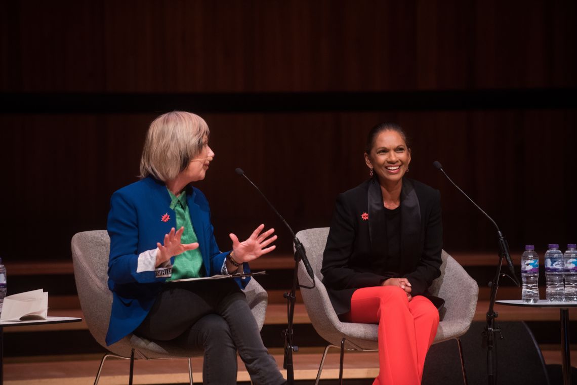 Two women sit on stage at WOW Festival