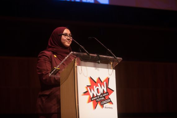 A school girl stands behind a lectern at WOW