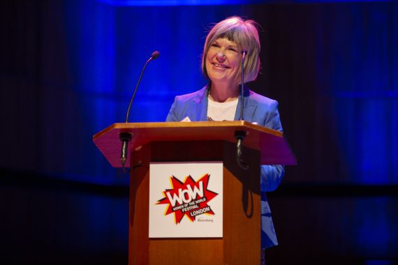Jude Kelly stands behind a lectern