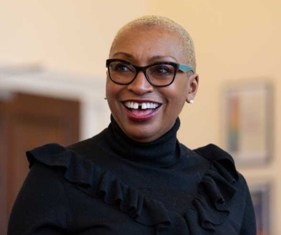 A woman looks up smiling